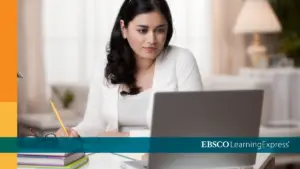 Woman studying on computer using Learning Express from the State Library of Kansas